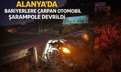 Alanya’da bariyerlere çarpan otomobil şarampole devrildi