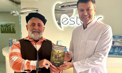 Kitabını hediye etti