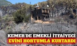 Kumluca'da emekli itfaiyeci evini alevlerden hortumla kurtardı