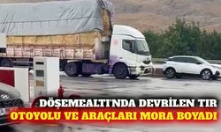 Döşemealtı'nda devrilen boya yüklü tır araçları mora boyadı
