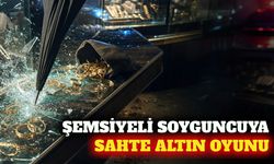 Şemsiyeyi silah gibi kullanan soyguncuya sahte altın oyunu