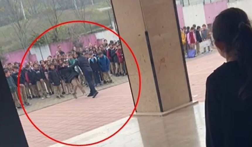 Okul müdürü öğrenciyi yakasından tutup yere savurdu